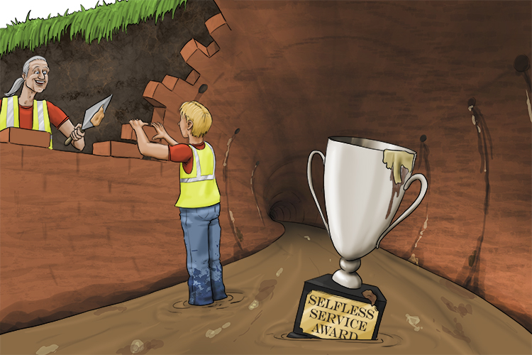 A new sewer (sewa) was built by the volunteers and they won an award for selfless service.